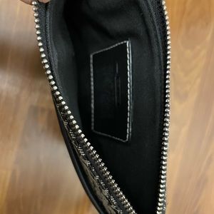 Black and grey Coach crossbody bag